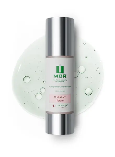 product arrangement of a modukine serum and a slightly green liquid with little bubbles in the background